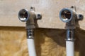 Water pipes made of polypropylene in the wall, plumbing in the house. Installation of sewer pipes in a bathroom of an apartment in Royalty Free Stock Photo