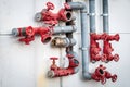 Water pipes with red valves Royalty Free Stock Photo