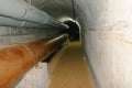 Water pipes in underground tunnel in rural Kenya Royalty Free Stock Photo