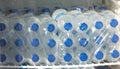 Water in plastic bottles on the shelf in refrigerator. Royalty Free Stock Photo