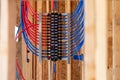 Water plumbing manifold for water distribution in new home construction. selective focus Royalty Free Stock Photo