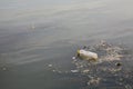Water pollution - plastic bottle on river surface Royalty Free Stock Photo