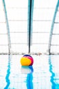 Water polo ball in the swimming pool. Royalty Free Stock Photo