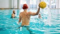 Water polo, ball and people in swimming pool training, exercise and fitness game or sports event. Professional swimmer Royalty Free Stock Photo