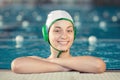 Water polo girl on pool edge Royalty Free Stock Photo