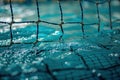 water polo net sitting within the vibrant blue waters of a pool Royalty Free Stock Photo