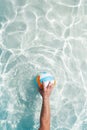 Water polo player with a ball in a blue pool water. Top view. Copy space Royalty Free Stock Photo
