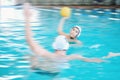 Water polo, shooting ball and people in swimming pool training, exercise and fitness game or sports event. Professional Royalty Free Stock Photo