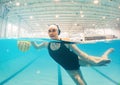 Water polo, sports and girl in swimming pool surface for game, competition and practice for match. Professional sport Royalty Free Stock Photo