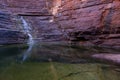 Water pool with rocks, waterfall in Joffre Gorge in Karijini National Park in Western Australia Royalty Free Stock Photo