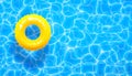 Water pool summer background with yellow pool float ring. Summer blue aqua textured background Royalty Free Stock Photo
