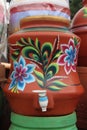 Water pot made from red clay and decorated with decorations
