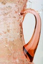 Water poured to the pink glass pitcher. Royalty Free Stock Photo