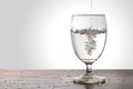 Water pouring into a glass Royalty Free Stock Photo