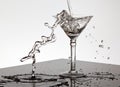 Water pouring into a Martini glass