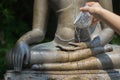 Water pouring to Buddha statue Royalty Free Stock Photo