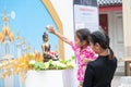 Water pouring to Buddha statue in Songkran festival tradition of Royalty Free Stock Photo
