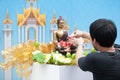 Water pouring to Buddha statue in Songkran festival tradition of Royalty Free Stock Photo