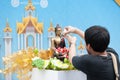 Water pouring to Buddha statue in Songkran festival tradition of Royalty Free Stock Photo