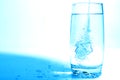 Water pouring in transparent glass with bubbles of air Royalty Free Stock Photo