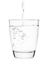 Water pouring into a tumbler glass isolated on white background. with clipping path Royalty Free Stock Photo