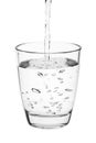 Water pouring into a tumbler glass isolated on white background. with clipping path Royalty Free Stock Photo