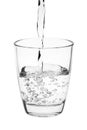 Water pouring into a tumbler glass isolated on white background. with clipping path Royalty Free Stock Photo