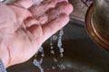 Water pours through fingers, close-up, concept: everything flows, everything changes Royalty Free Stock Photo