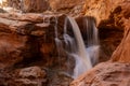 Water Pours Over Cliff Edge in Sulphur Creek Royalty Free Stock Photo