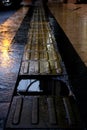 Water puddle on the pavement. Pedestrian sidewalk hole. Rainy day in the city Royalty Free Stock Photo