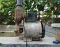 a water pump machine that is rusty and no longer working Royalty Free Stock Photo