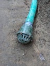 water pump suction pipe placed on ground. Royalty Free Stock Photo