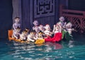 Water puppet men in boats in the Thang Long Water Puppet Theatre, Hanoi, Vietnam