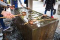 Water purification at the Buddhist temple Royalty Free Stock Photo