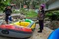 Water rafting at Gopeng Perak. The coach is briefing the students about the safety while water rafting in the streams