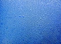 Water raindrops nano effect on a blue background