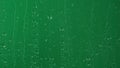 Water rainfall, rain drops falling on window glass over chroma key green screen