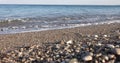 Water recedes from stones and sea beach