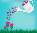 Water red heart on flower by Watering can full of red heart