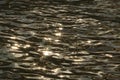 Water reflecting the rays of the setting sun Royalty Free Stock Photo