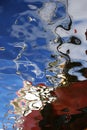 Water reflection of a fishing boat,interesting abstract image with unique colors and shapes.s.