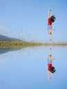 Water Reflection Happy Woman Jumping with blue sky Royalty Free Stock Photo