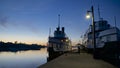Water reflection of the the pier with steamships at twilight Royalty Free Stock Photo
