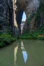 The water reflection of Qinglong Bridge in Wulong Karst, Chongqing, China, presents a serene and picturesque scene Royalty Free Stock Photo