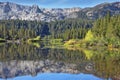 In the water reflects the majestic mountains