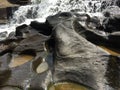 Water on small holes on the stone