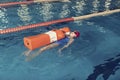 Water Rescue Training One Girl in a School Pool Corridor Royalty Free Stock Photo