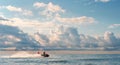 The water rescuer patrols sea shore on a jet ski