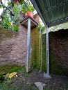 water reservoir is placed above orange water tower, brick wall