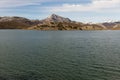 Water reservoir in swamp surrounded by mountains